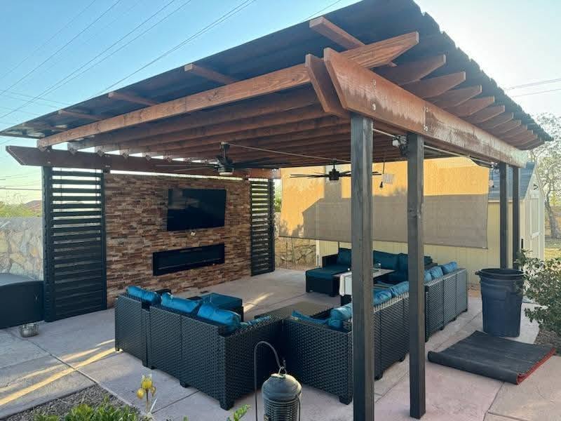 Freshly stained cedar deck with attached pergola in a San Antonio backyard